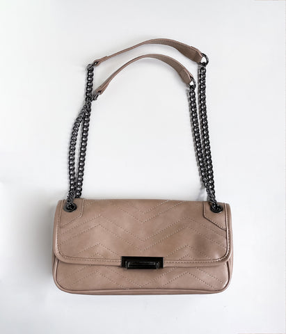 Straight on angle of nude coloured shoulder bag with stitching detail and chainlink strap