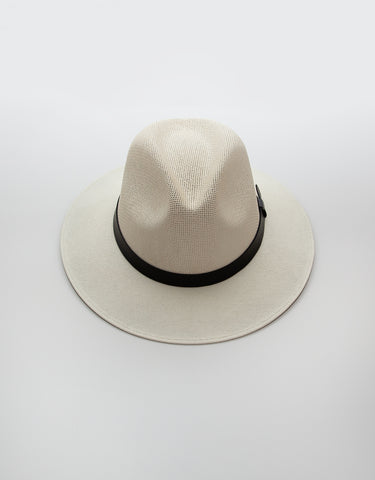 Ivory coloured fedora hat on white background 