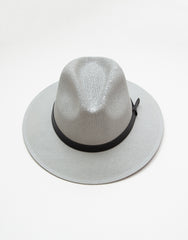 Product shot of a grey fedora style hat with a black strap detail  on a white background